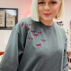 Shop Brittany Allen Pink Butterfly Swarm Sweatshirt OUTERWEAR