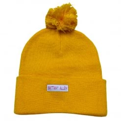 Shop Brittany Allen ACCESSORIES + TOTES Golden Butterfly Pom Pom Beanie