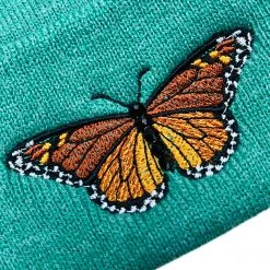 Shop Brittany Allen Green Monarch Pom Pom Beanie ACCESSORIES + TOTES